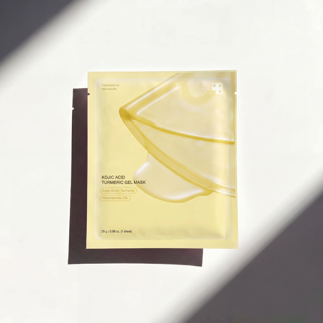Thejijo Kojic Acid Turmeric Gold Collagen Mask spread on the skin, showing a bright, golden facial mask for skincare.